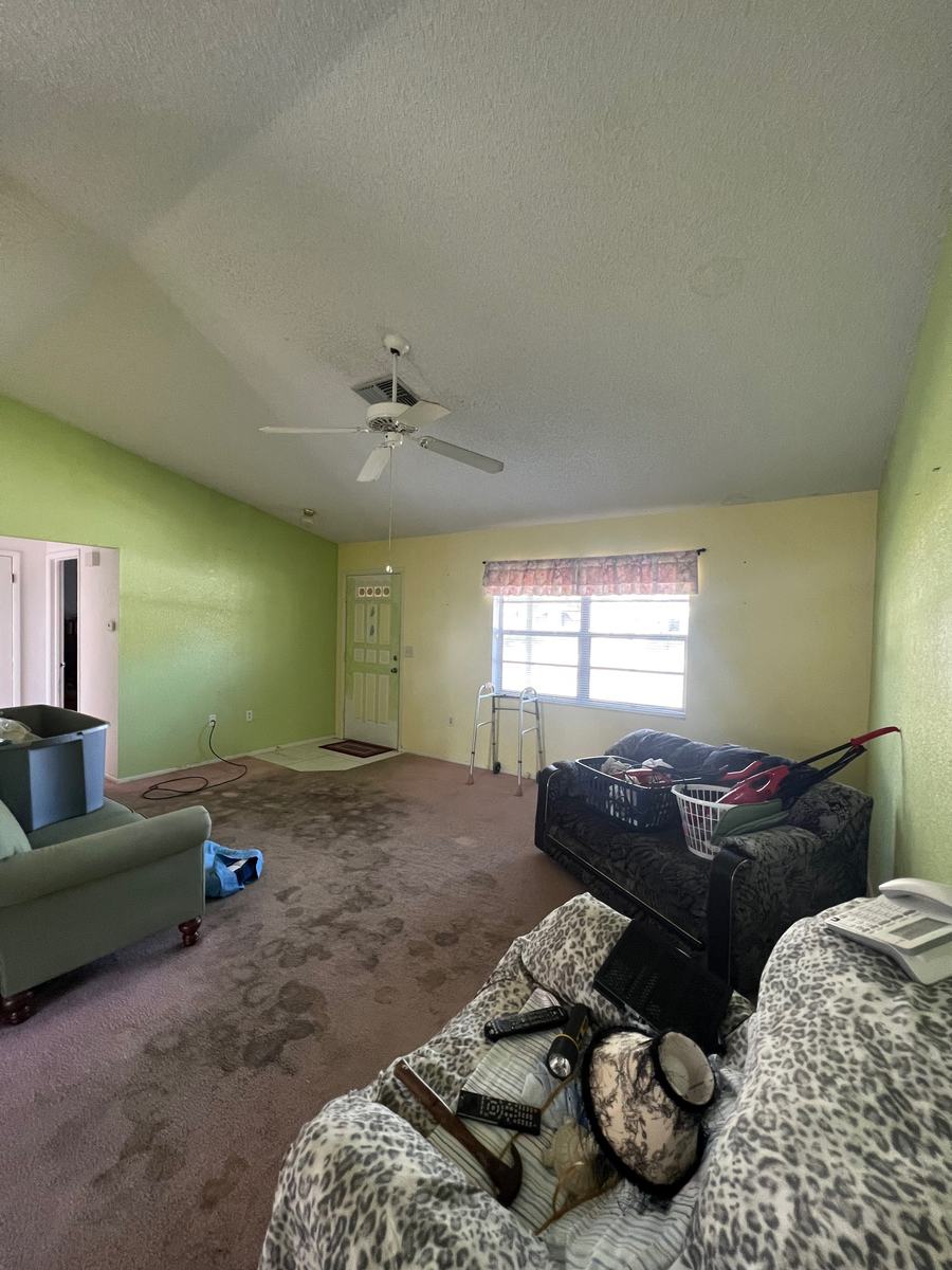 Stained carpet, belongings left behind