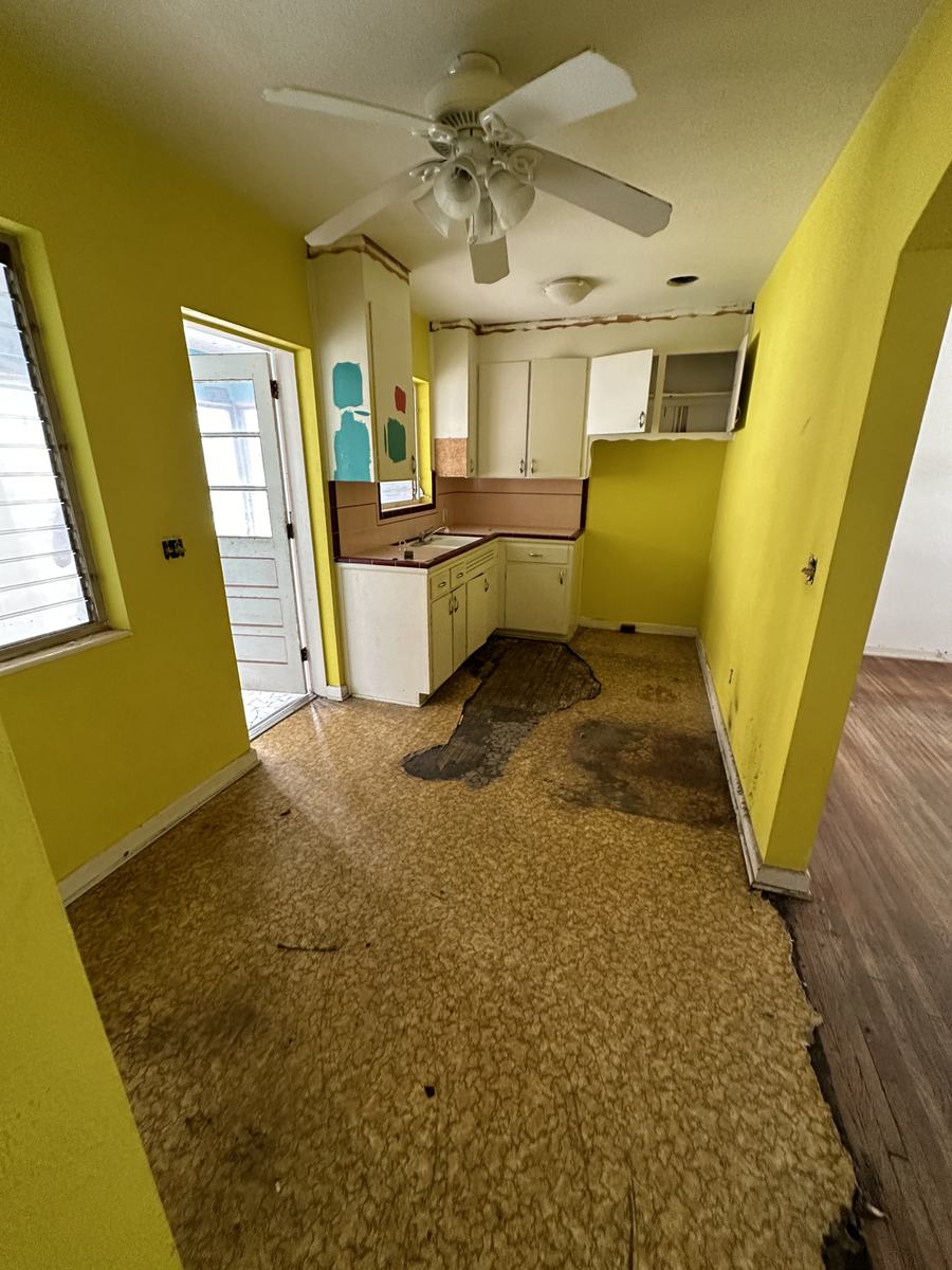 Old cabinets, damaged flooring